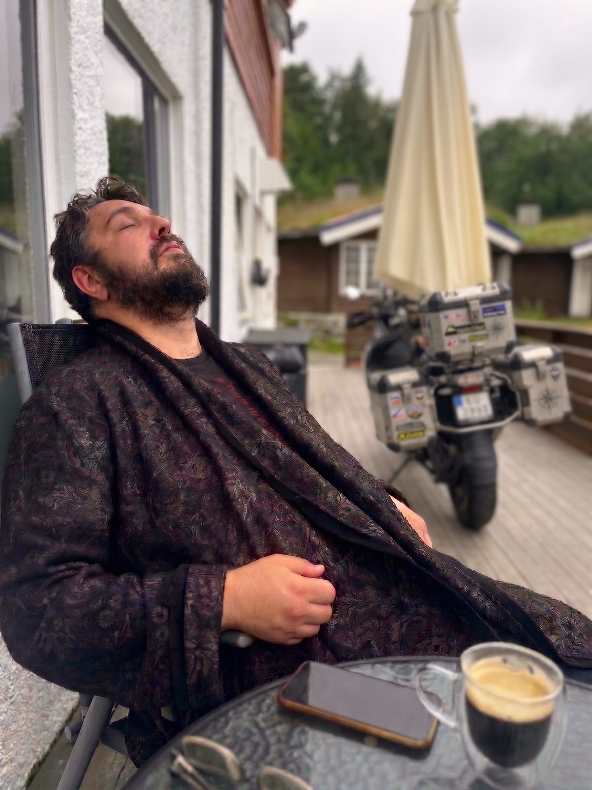 Resting on the terrace after the road — biker at Terråk Gjestegård